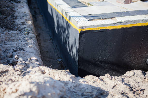 Professional Waterproofing technician working in Commiskey, IN